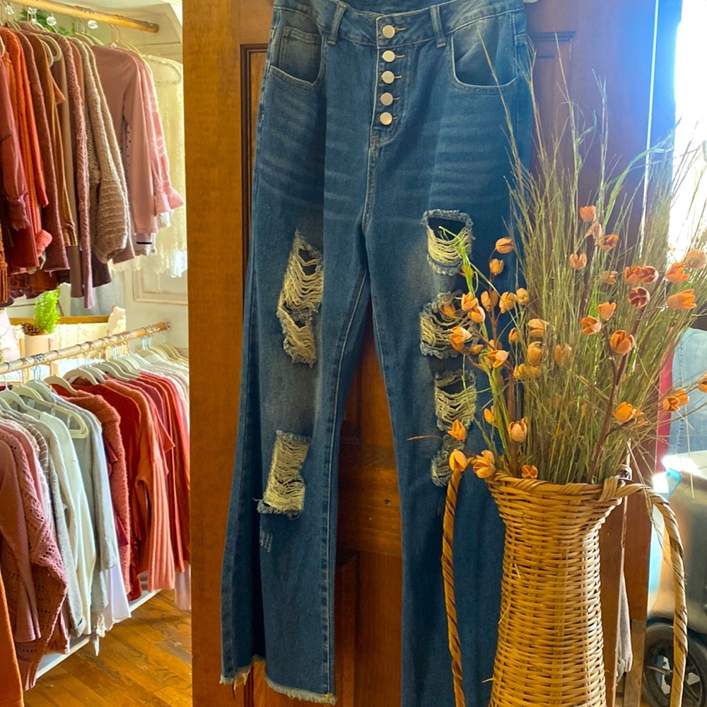 Wide leg, distressed jeans with silver buttons